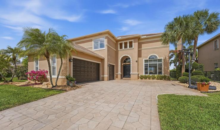 Front exterior of 1332 Beacon Circle in Black Diamond Wellington FL