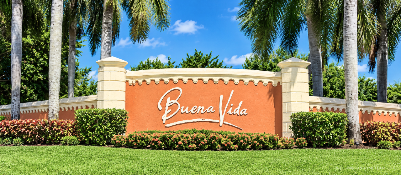 Buena Vida community entrance sign surrounded by palm trees in Wellington, FL