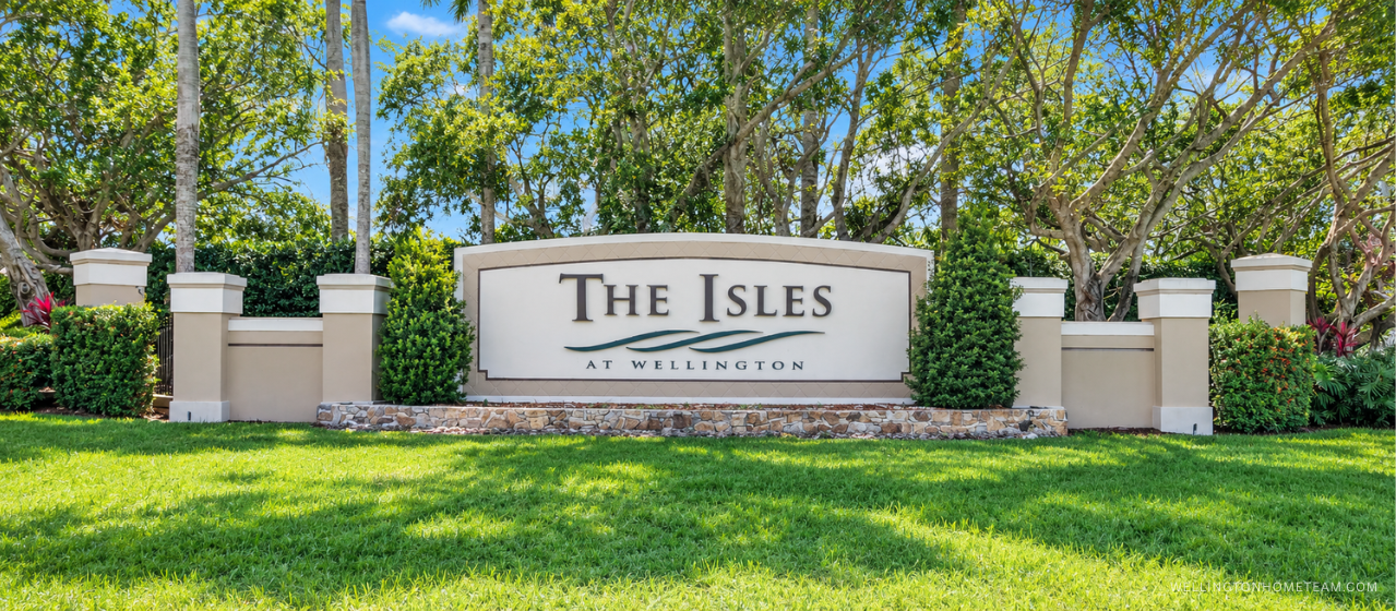 Isles at Wellington community entrance sign surrounded by palm trees in Wellington, FL