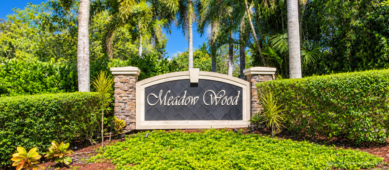 Meadow Wood community entrance sign surrounded by palm trees in Wellington, FL