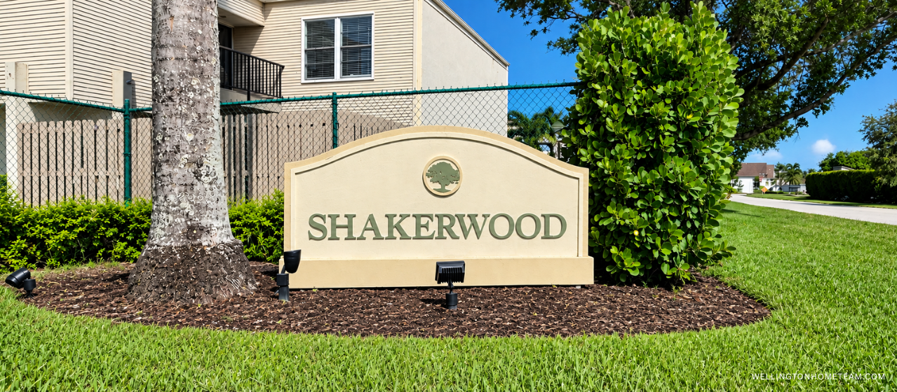 Shakerwood at French Quarter Wellington FL Townhomes for Sale Shakerwood community entrance sign surrounded by palm trees in Wellington, FL