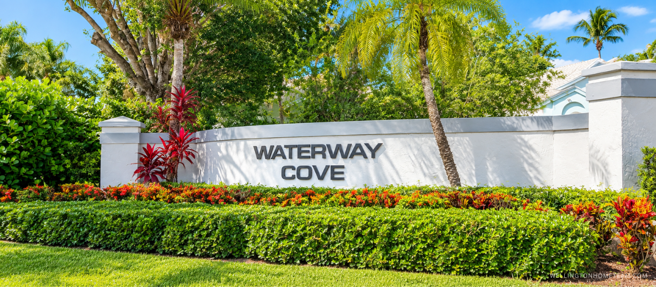 Waterway Cove community entrance sign surrounded by palm trees in Wellington, FL