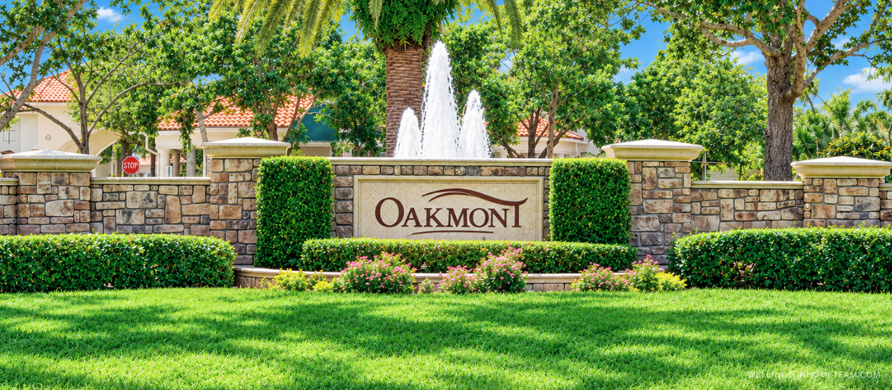 Oakmont Estates community entrance sign surrounded by palm trees in Wellington, FL