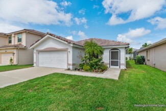 Grand Isles Wellington FL Homes for Sale & Real Estate Grand Isles Home Exterior – Mature Landscaping