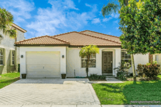 Grand Isles Wellington FL Real Estate and Community Guide Grand Isles One-Story Lakefront Home with One-Car Garage